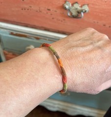 Handmade Friendship Bracelet. Red, Brown, Green, and Orange. Adjustable.