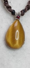 Tiger’s eye cabochon with sterling silver wire handmade with amber beads