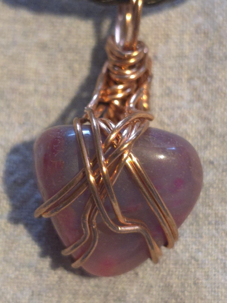 Pink Agate Pendant On A Brown Leather Necklace