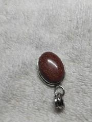 Goldstone Pendant. Bezel Set In Handmade Rhodium Plated Mounting.