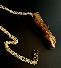 Handmade one of a kind jewelry made from real pieces of wood coated in resin
