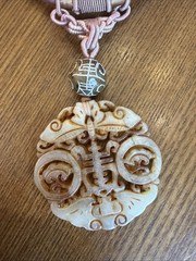 Hand-carved Necklace With pendant, reminiscent of traditional Asian carvings
