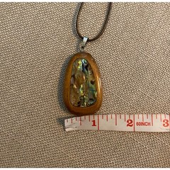 Abalone inlaid in polished wood pendant on cord