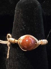 Handmade sizes 4 – 15 Wire-Wrapped Goldstone Rings with Gold-Tone Plated Wire