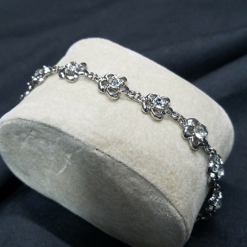 7 1/2″-9″ Adjustable 11 white Crystal Flowers Silver Tone Over Copper Bracelet