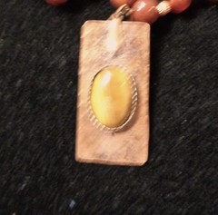 Artisan crafted,1 ¾ x ¾» hammered, antiqued copper pendant with applied Tiger ey