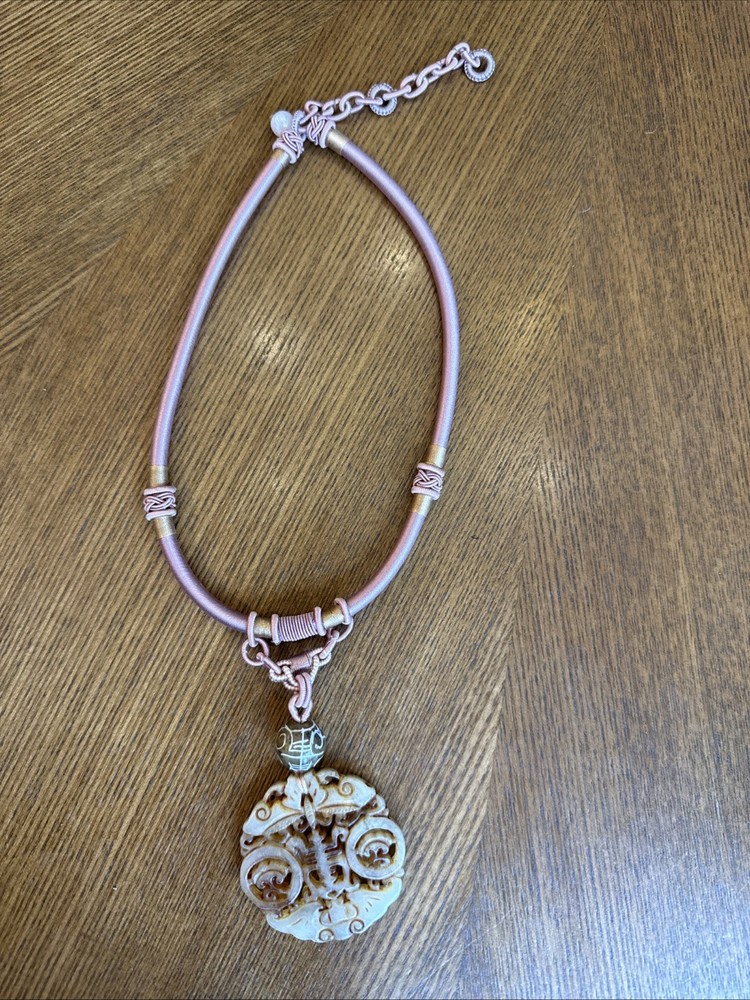 Hand-carved Necklace With pendant, reminiscent of traditional Asian carvings