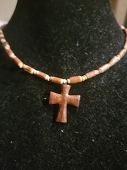Wooden cross necklace hand-carved brown wood pendant on a coconut bead chain.