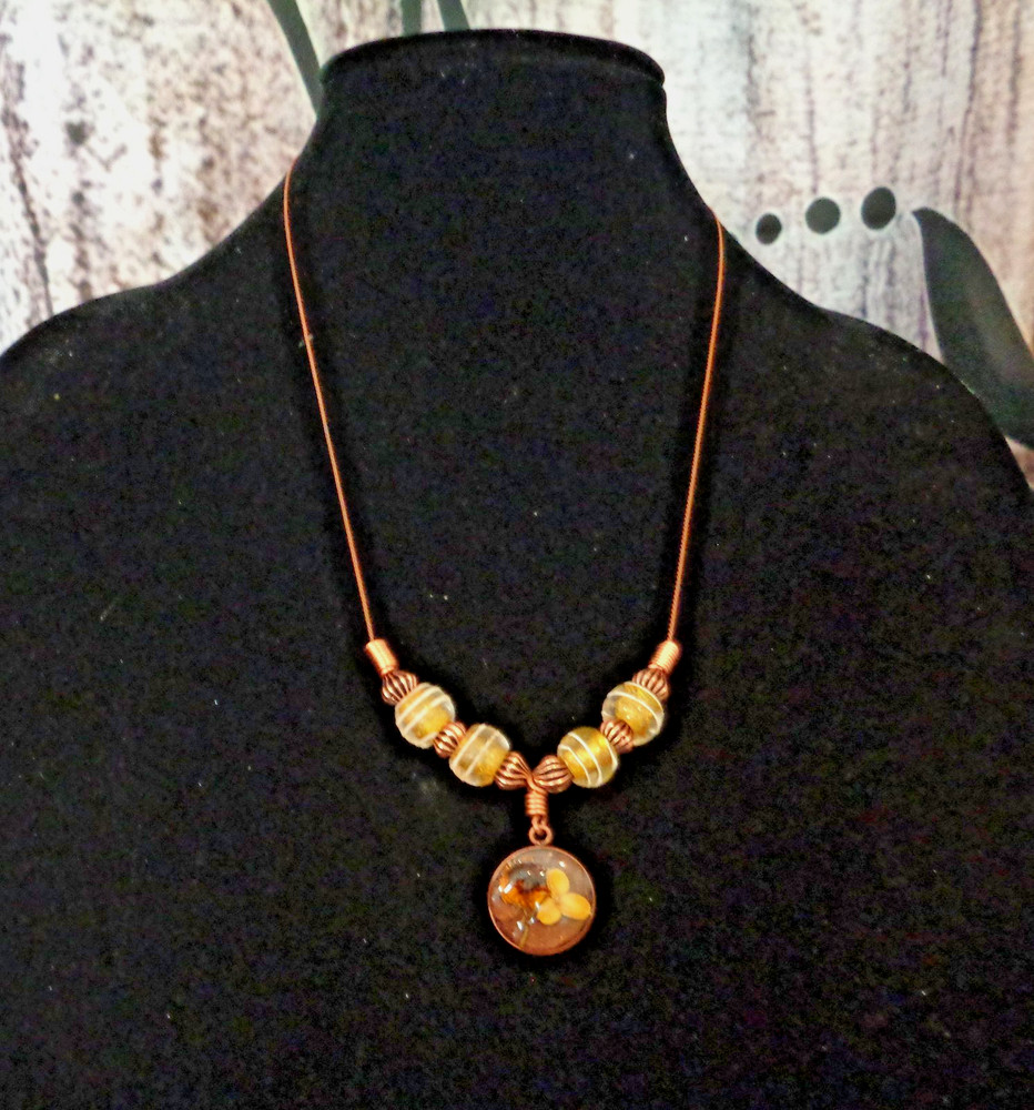 Artisan crafted, 15mm resin and dried flower pendant on strand of vintage yellow