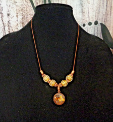 Artisan crafted, 15mm resin and dried flower pendant on strand of vintage yellow