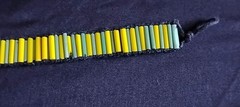 6 1/2 Inch Long Glass Bead, Hemp Twine, Polyester Thread, Plastic Button Closure