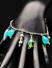 Uranium glass assorted bead charm? bracelet style on silver rolo chain 7″