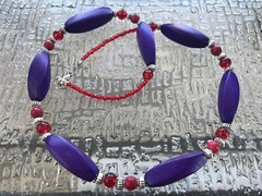 Handmade Necklace of Bright Purple Dyed Twisted Oval Wood with Red Glass Beads